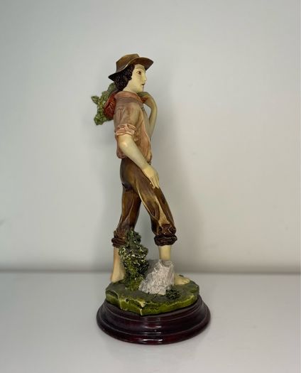 Boy with a basket figurine signed Ballester