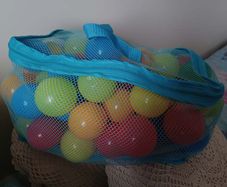 Bag of colourful plastic play balls