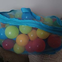 Bag of colourful plastic play balls