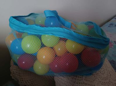 Bag of colourful plastic play balls