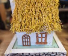 Thatched cottage bird house