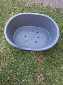 Small plastic dog bed.