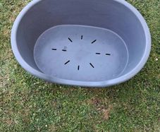 Small plastic dog bed.