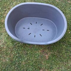 Small plastic dog bed.