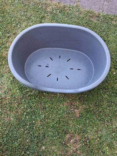 Small plastic dog bed.