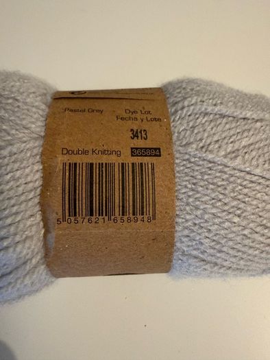 5 balls of grey yarn wool