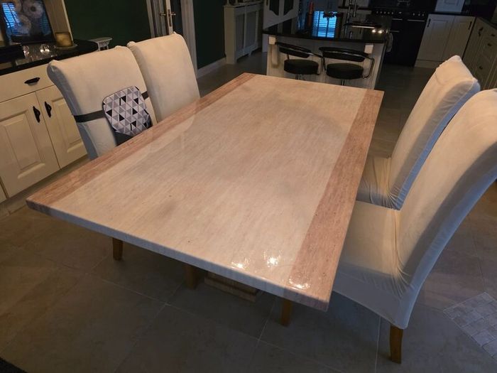 Marble table with 4 cream leather chairs