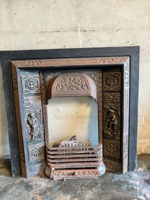 Fireplace insert and metal plinth surround