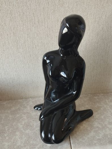 Vintage statue of a seated woman, nude figure, ceramic, glossy black.