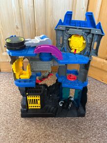 Batmans batcave with Batman and bike.