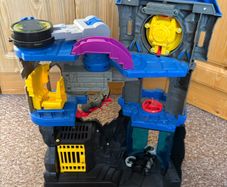 Batmans batcave with Batman and bike.