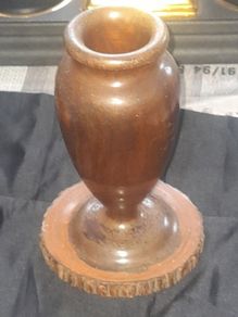 A Beautiful Vintage Wooden Vase made from a single piece of wooden log has been carefully turned on a lathe to create this urn shaped vase. Original bark details remain around the base