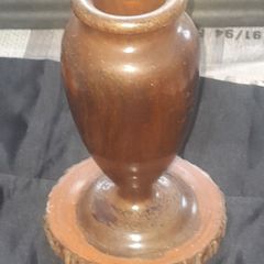 A Beautiful Vintage Wooden Vase made from a single piece of wooden log has been carefully turned on a lathe to create this urn shaped vase. Original bark details remain around the base