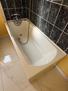 Bath with tap