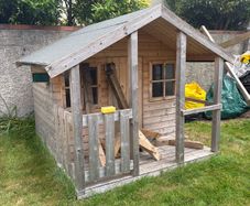 kids playhouse and swing set
