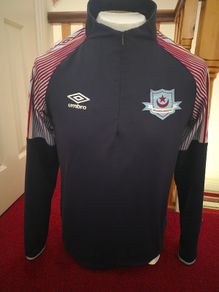 Drogheda United half zip warm up top.
