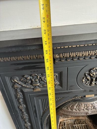 Beautiful ornate fire surround, cast Iron. Granite hearth and fire front. Very good condition