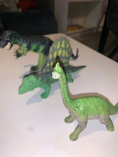 Three dinosaur toys
