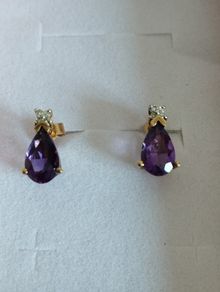9ct yellow gold amethyst and diamond stud earrings.