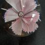 Glass paperweight with pink flower design Image 3