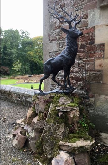 Pair of life size bronze deer statues