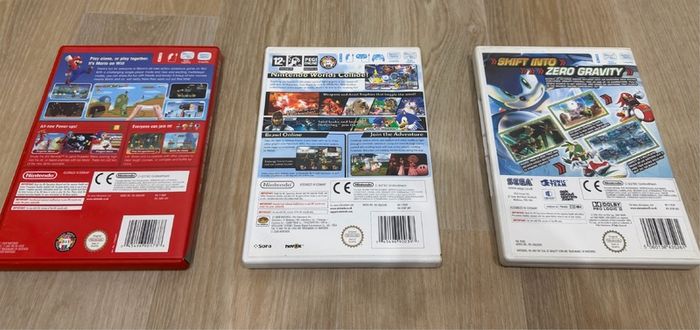 Wii games bundle - Mario bros Wii, Smash Bros Brawl, and Sonic Riders