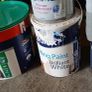 a selection of paint and a paint roller and some good paint brushes Image 8