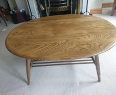Vintage Ercol style oval coffee table with magazine rack