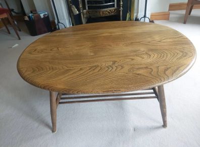 Vintage Ercol style oval coffee table with magazine rack