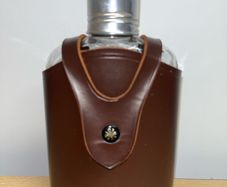 Vintage whiskey flask in brown leather case