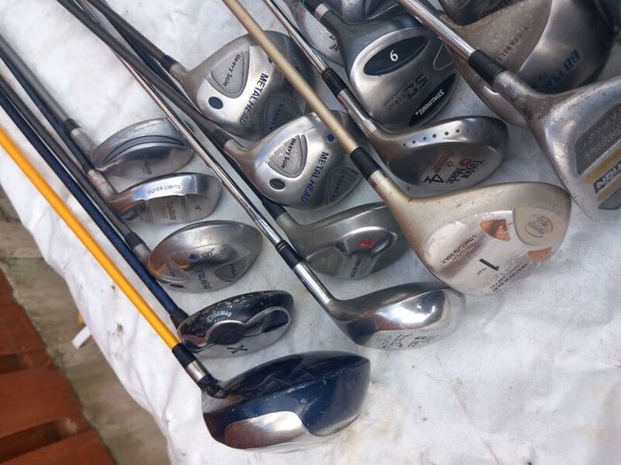 A selection of golf clubs and bags. Golf balls