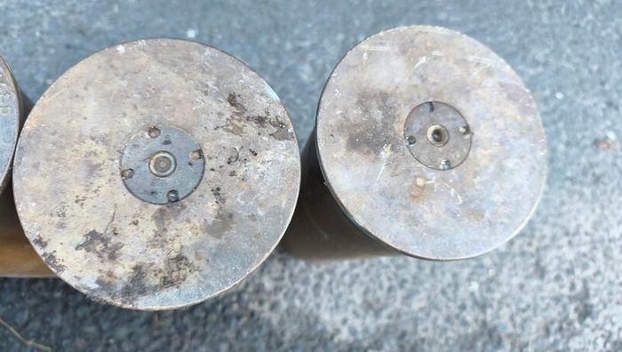 four empty brassartillery shell casings