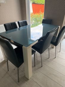 Glass topped dining table and six chairs