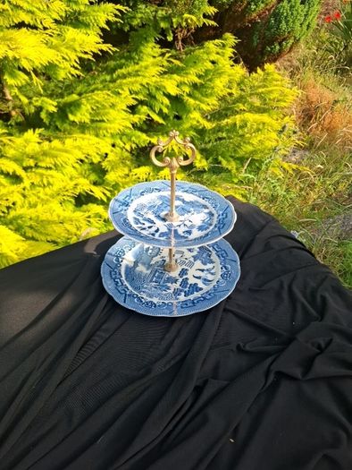 Blue willow style cake stand light chip at the back