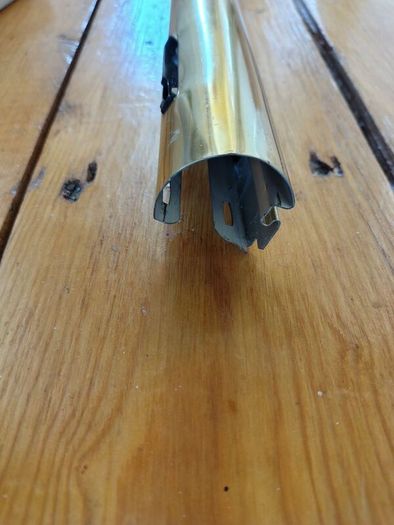 Brass coloured curtain track