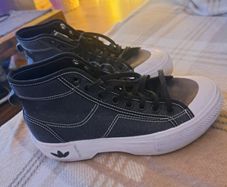 Black and white Adidas Nizza trek trainers
