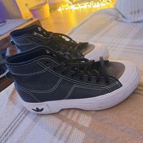 Black and white Adidas Nizza trek trainers
