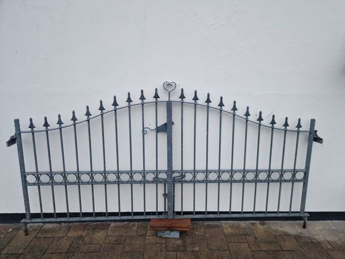 Decorative galvanised double steel gates.