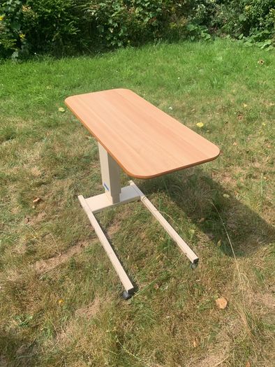 Adjustable height table for the infirm
