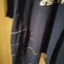long-sleeved navy garment is an oversized graphic Jacket cardigan. Image 6