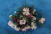Small artificial bouquet of flowers