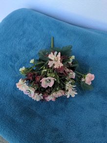 Small artificial bouquet of flowers
