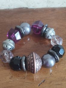 Vintage bracelet with purple beads.