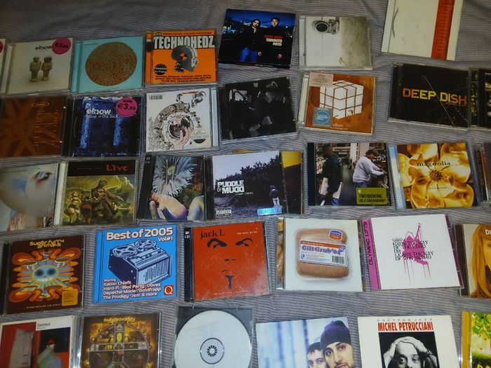Collection of 58 assorted music CDs