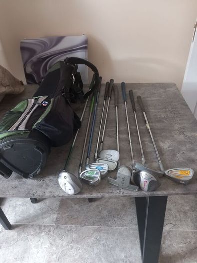 A selection of junior golf clubs and bag.