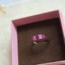 Beautiful yellow gold ring featuring three stunning rubies surrounded by sparkling cubic zirconia stones. Size M, in beautiful condition. Image 2