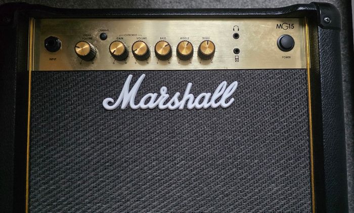 Squier Stratocaster electric guitar and Marshall MG15 amplifier