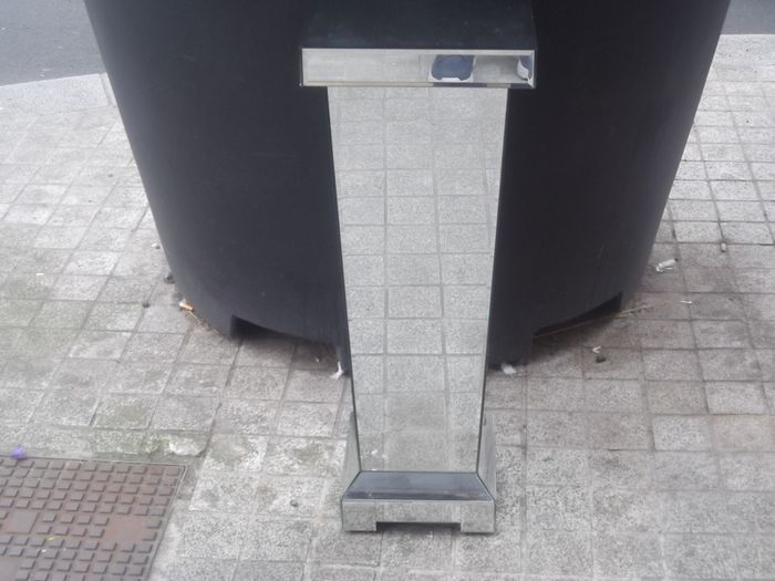 a shops display stand with mirror all round it