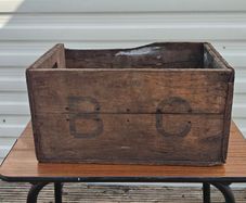 Old beer bottle crate stamped "B C" and "4  69"