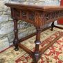 Early 20th Century Jacobean Revival Carved Oak hall table. Image 5
